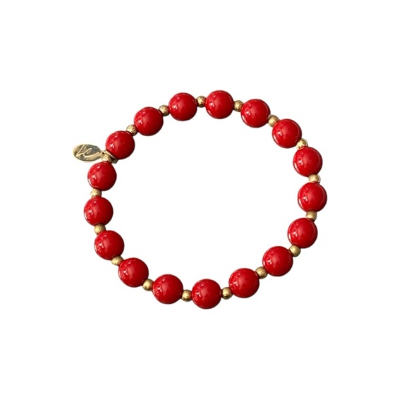 Lauren Conrad Cherry Red and Gold Toned stretch bracelet with logo tag. - Picture 1 of 3